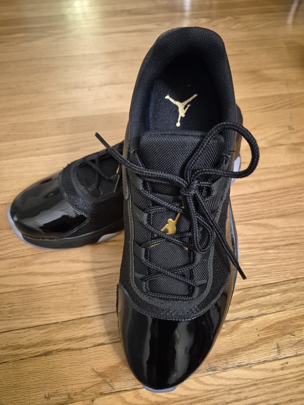 Jordan 11 CMFT Low Retro Low-Top Men's Sneakers in Black and Gold (and Blue)